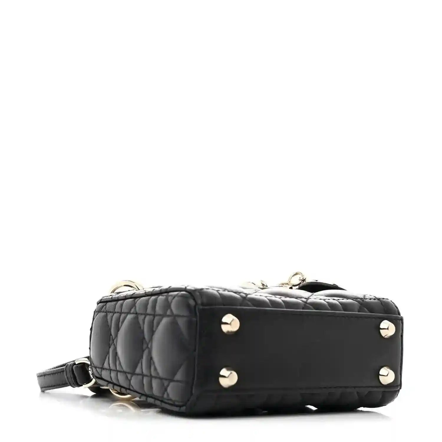 Black quilted micro handbag with gold-tone stud accents and short shoulder strap