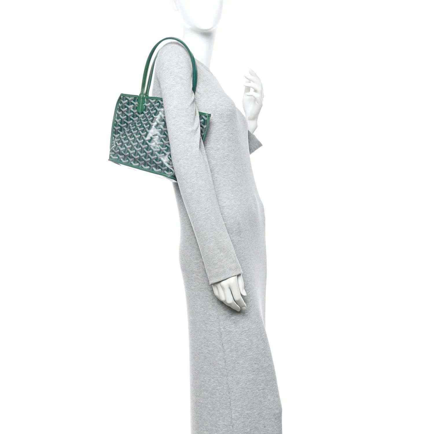 Green reversible mini tote bag shown from side with top handles and patterned body
