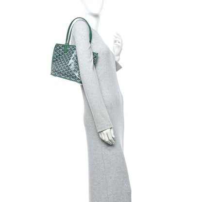 Green reversible mini tote bag shown from side with top handles and patterned body