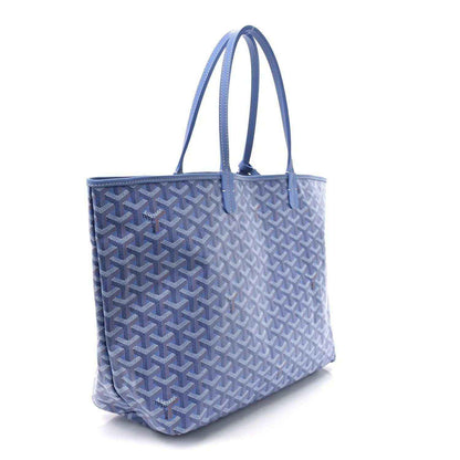 Goyardine tote bag with dual handles, blue repeating pattern and structured body