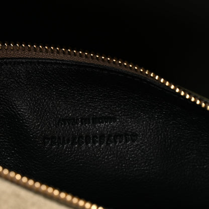 Leather hobo bag interior with embossed texture and gold zipper trim