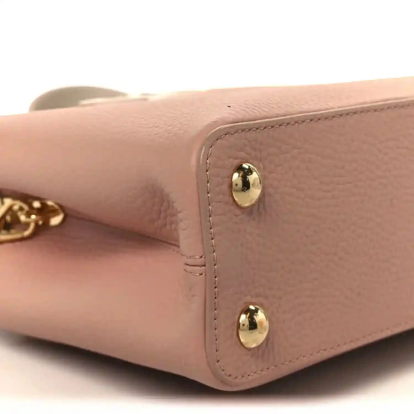 Rose leather handbag side panel with gold stud hardware