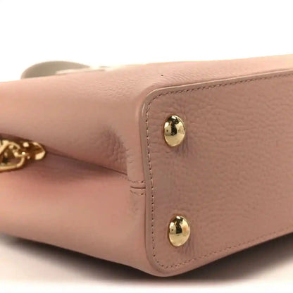 Rose leather handbag side panel with gold stud hardware