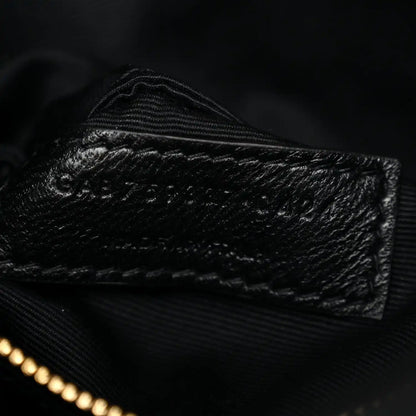 Saint Laurent quilted lambskin interior close-up with stitched seam and zipper