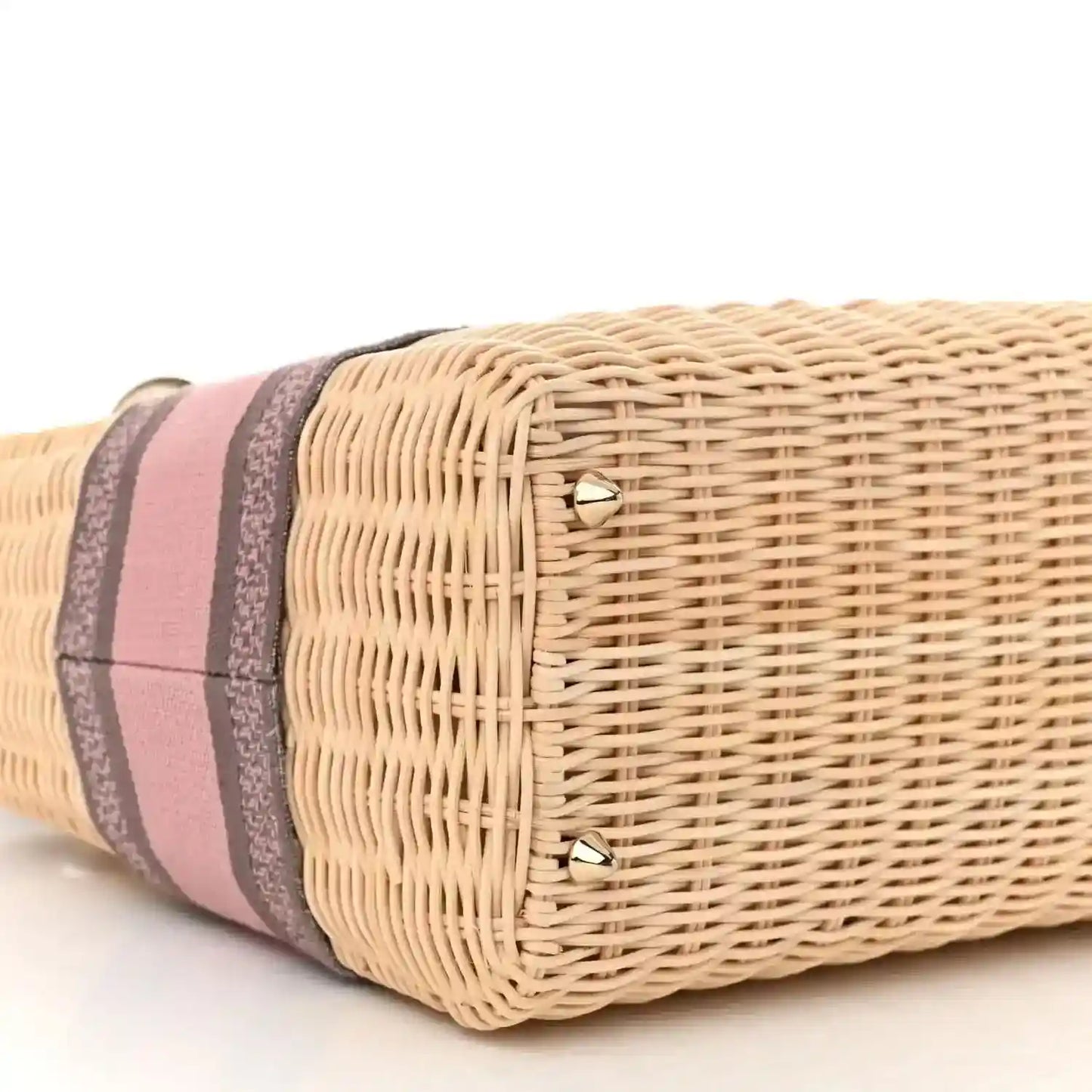 Wicker bag end with pink and gray striped band and gold corner studs