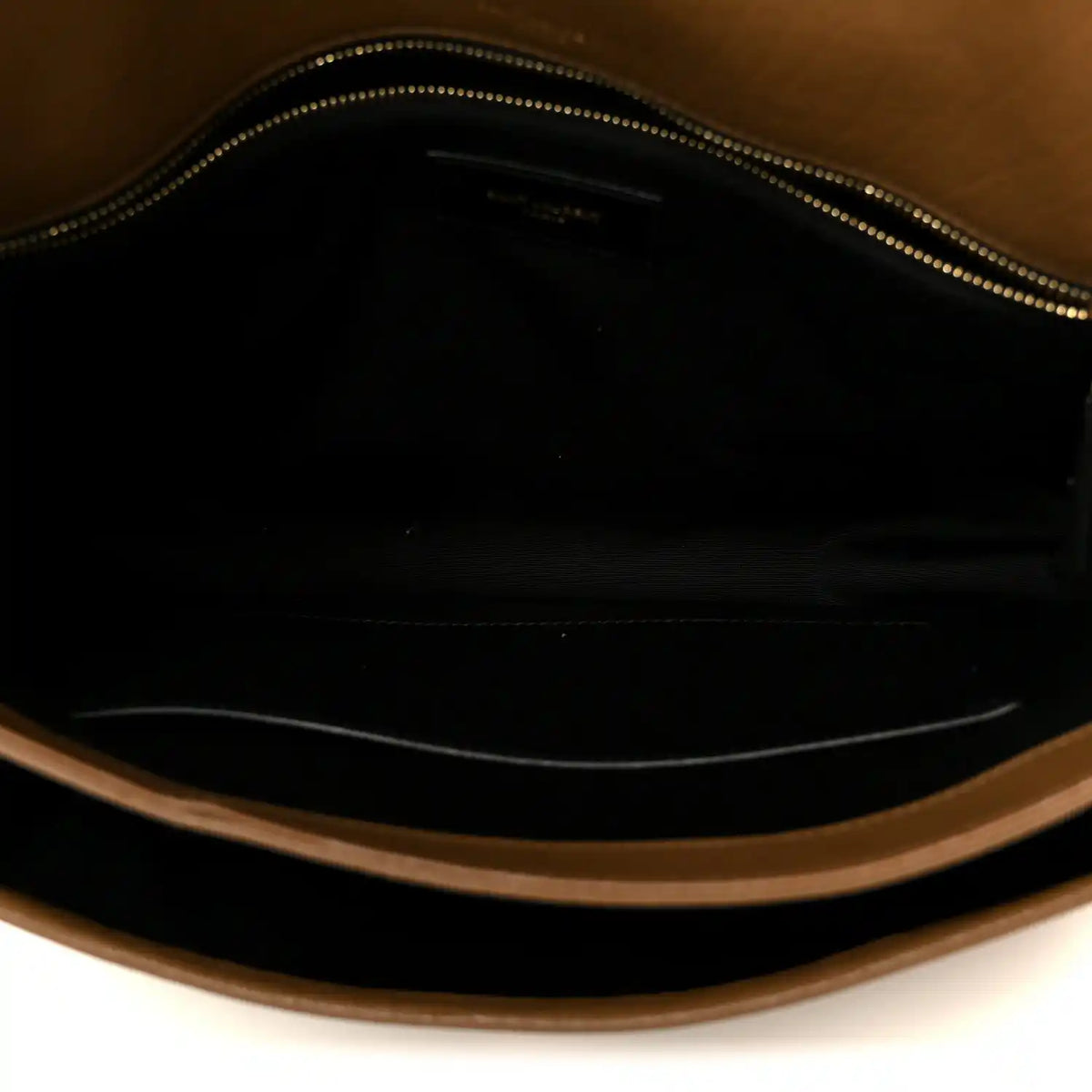 Satchel interior with zippered opening and dark lining, grained leather trim.