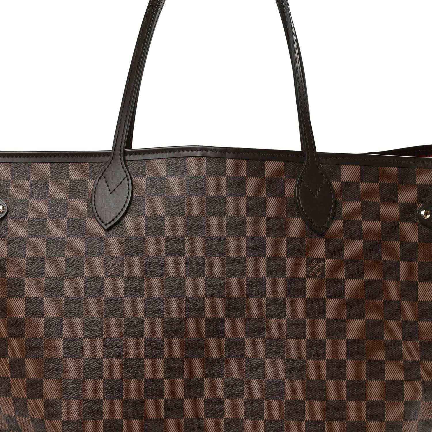 Damier Ebene canvas tote bag close-up of curved leather handle loops and checker pattern