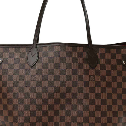 Damier Ebene canvas tote bag close-up of curved leather handle loops and checker pattern