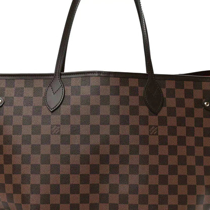 Damier Ebene canvas tote bag close-up of curved leather handle loops and checker pattern