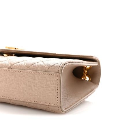 Dark beige satchel side close-up showing quilted seam lines and small gold-tone chain hardware.