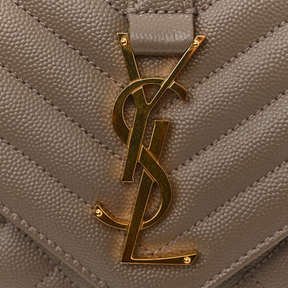 Gold YSL monogram on quilted satchel flap