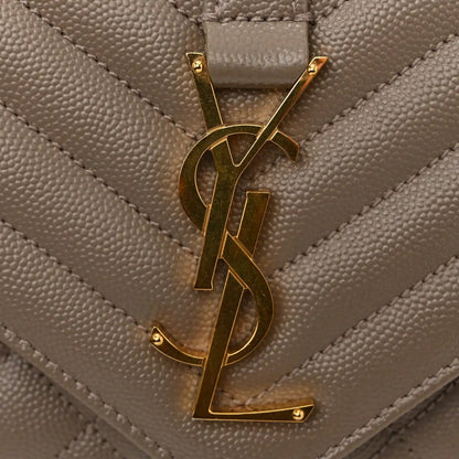 Gold YSL monogram on quilted satchel flap