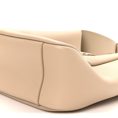 Light beige hobo bag base with curved edges and stitched side panels