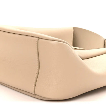 Light beige hobo bag base with curved edges and stitched side panels