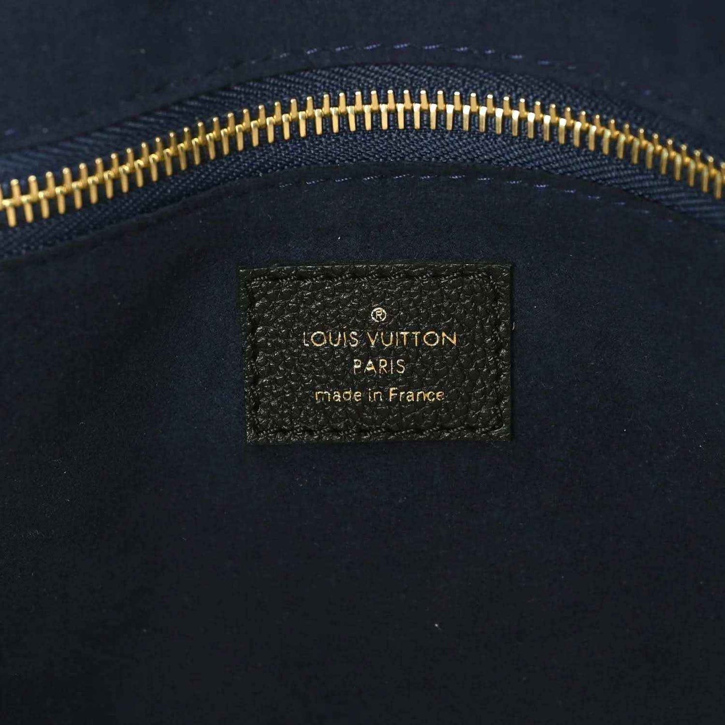 Louis Vuitton Paris made in France leather bag label with gold zipper trim
