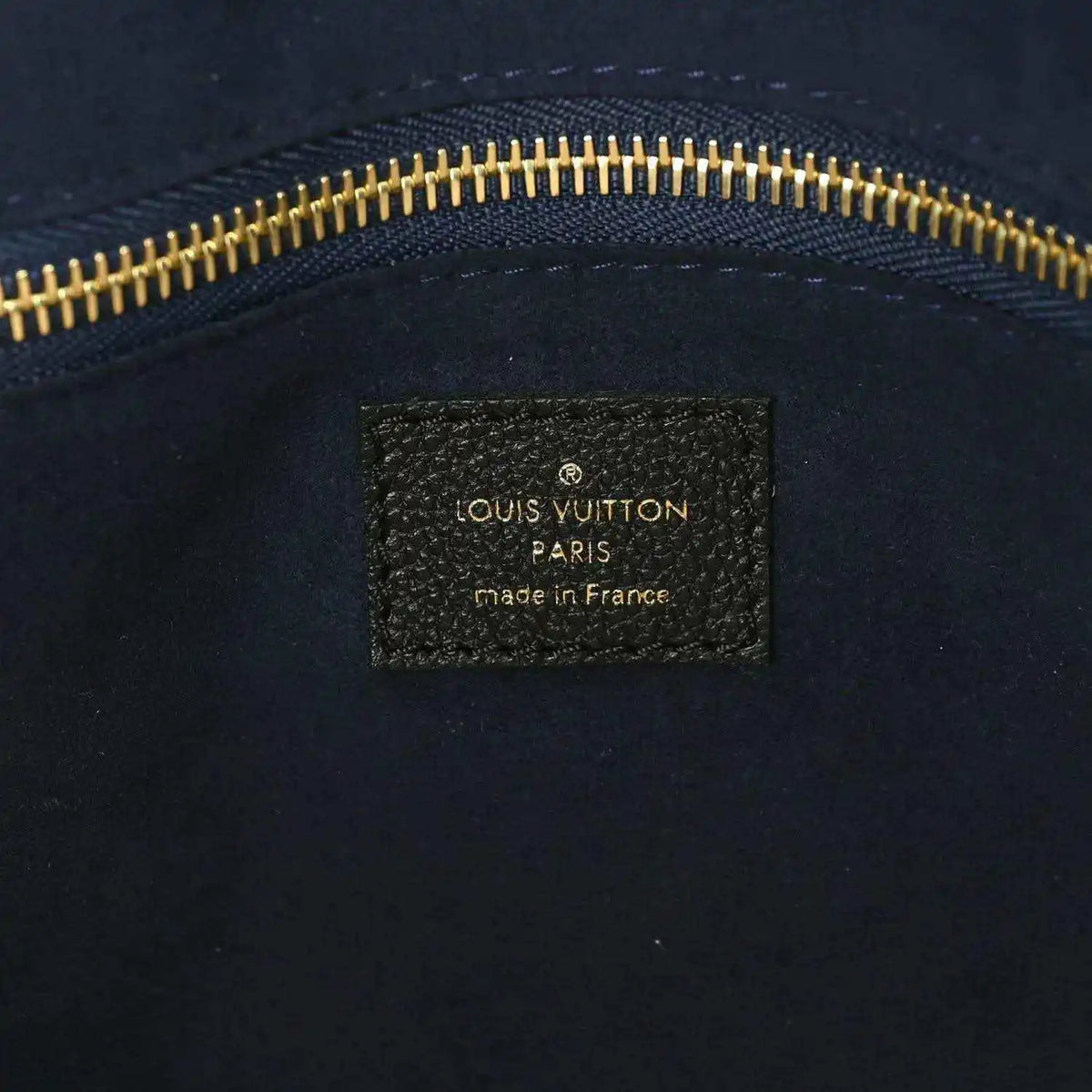 Louis Vuitton Paris made in France leather bag label with gold zipper trim