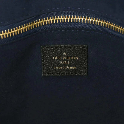 Louis Vuitton Paris made in France leather bag label with gold zipper trim