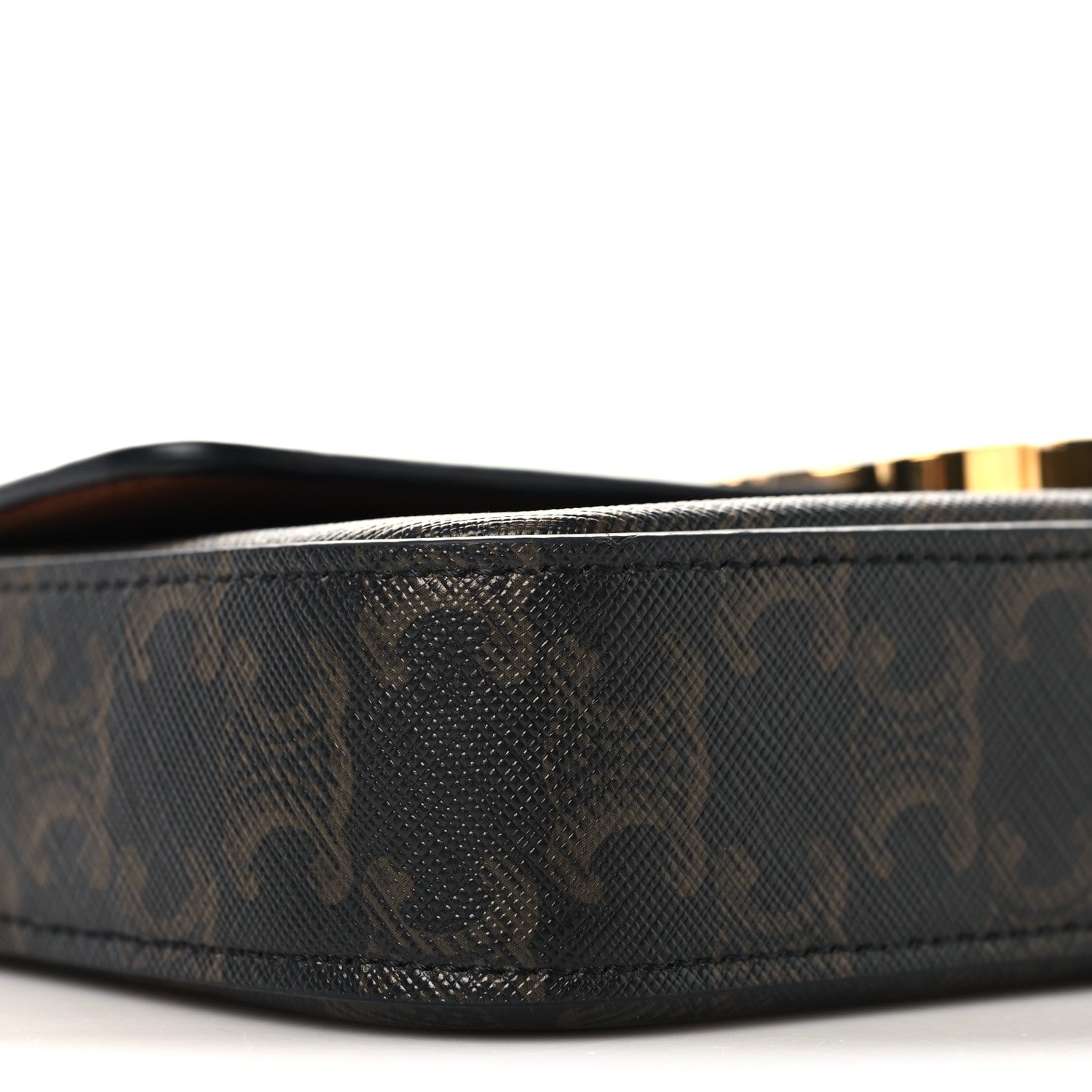 Celine canvas shoulder bag side profile with dark monogram texture