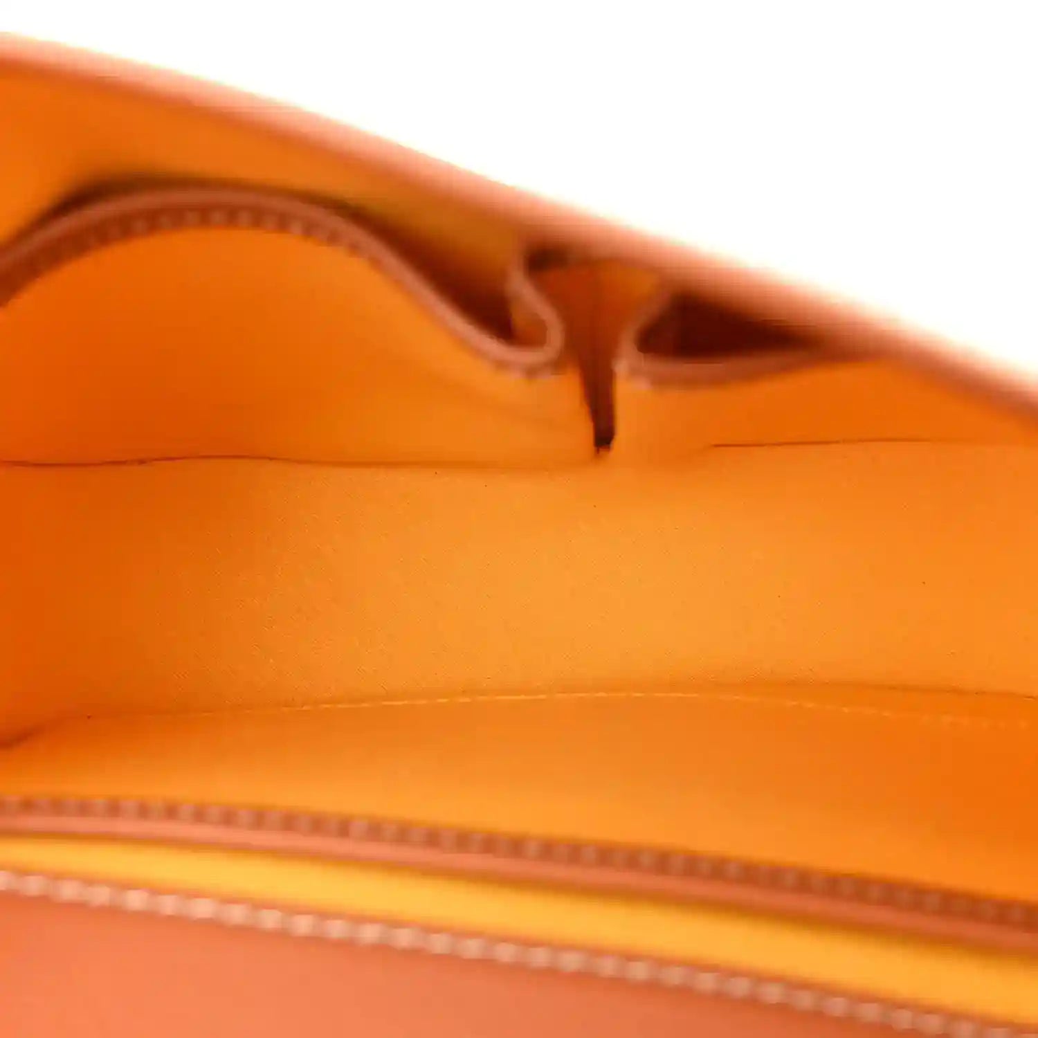 Tan leather interior with stitched seam and zipper track