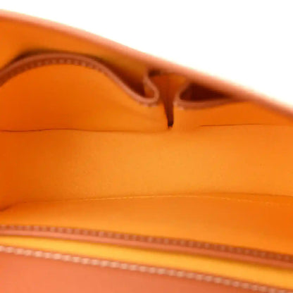 Tan leather interior with stitched seam and zipper track