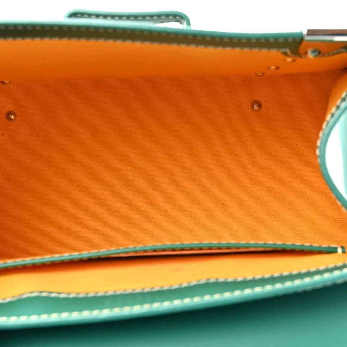 Goyard Saigon PM green canvas bag interior with orange leather base and edge stitching