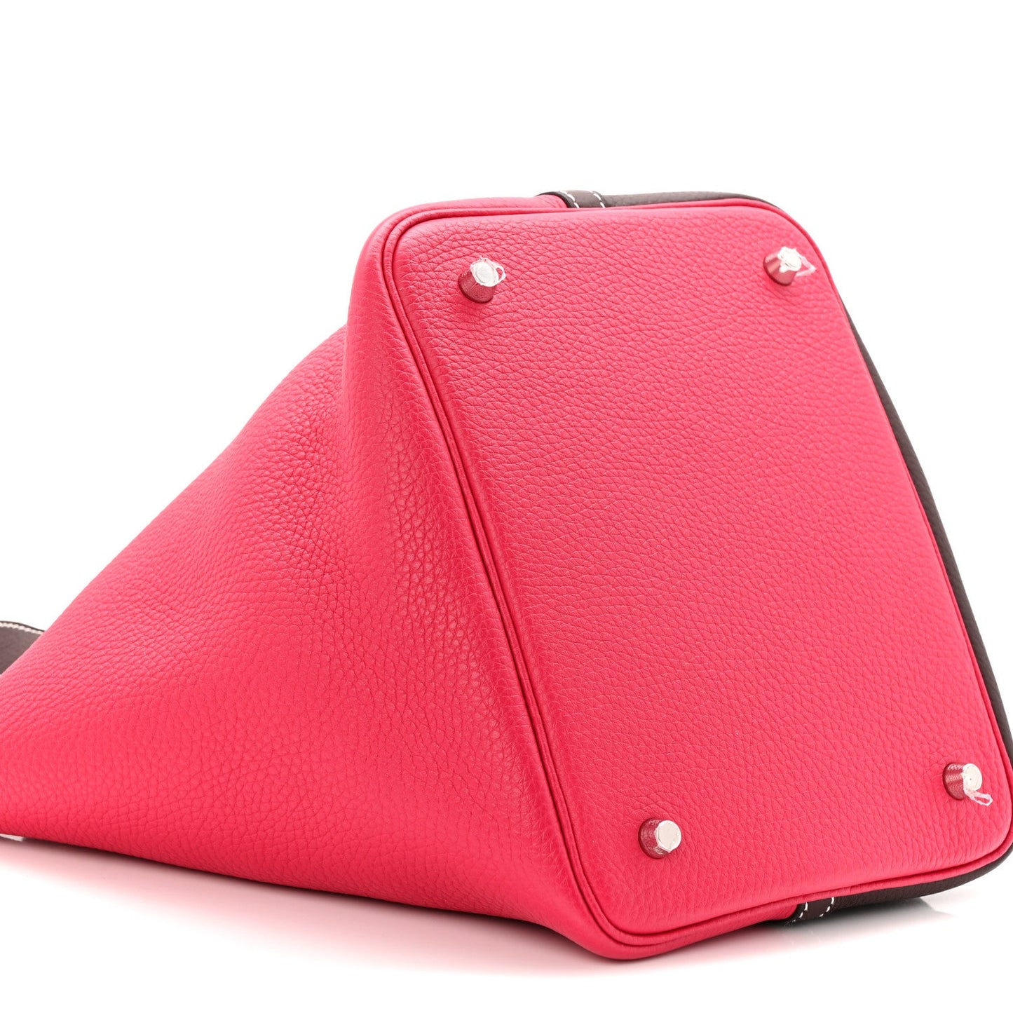 Bright red bucket bag with dark brown trim and silver-tone corner studs