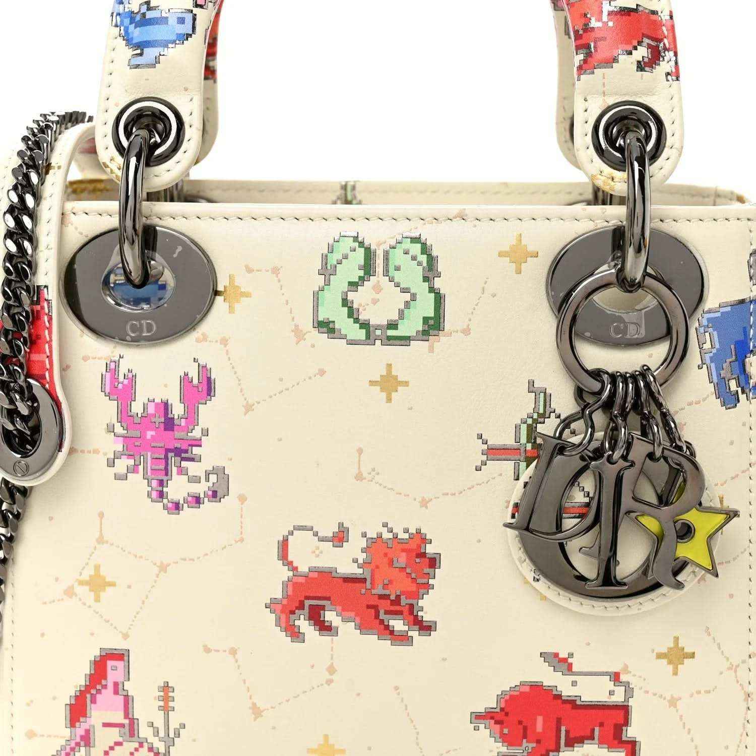 Mini Lady Dior bag front with pixel zodiac motif, silver rings, chain strap charms