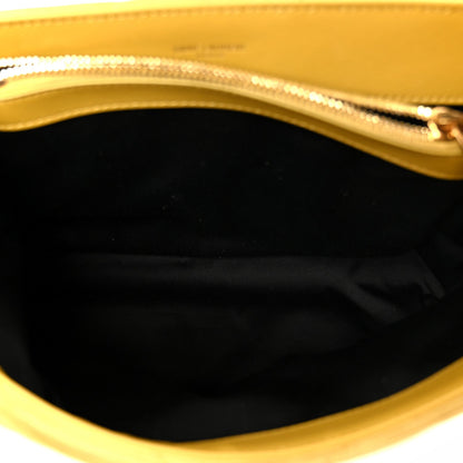 Suede satchel interior lining with gold-tone zipper trim and black fabric lining