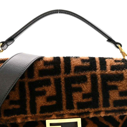 Black leather top strap with tobacco-brown shearling front panel and FF logo.
