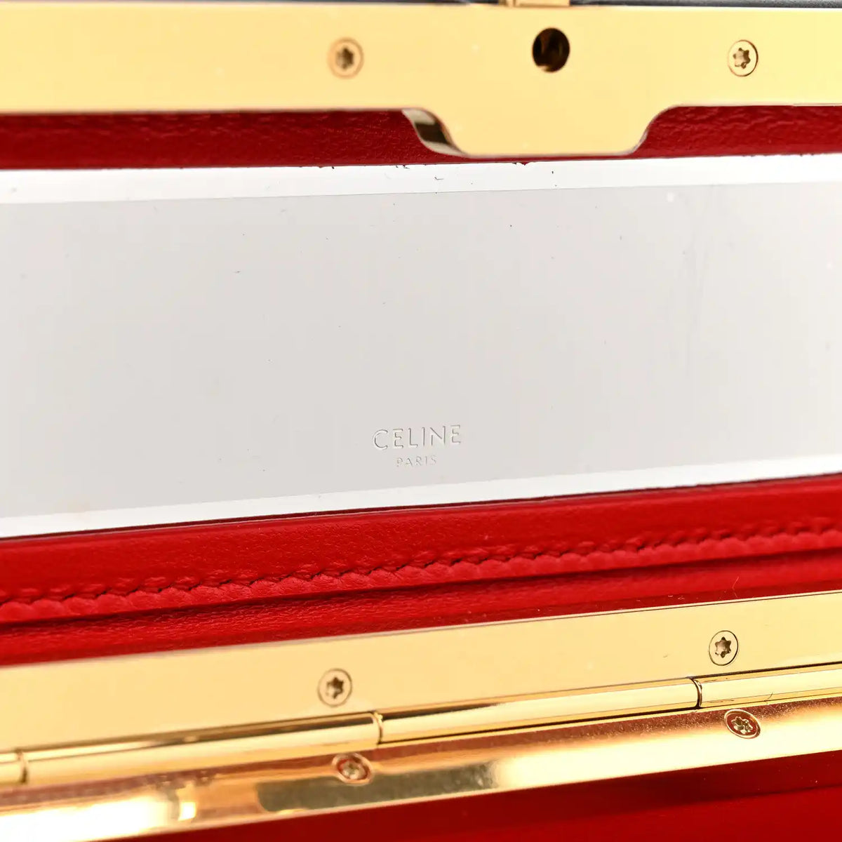 Black leather rectangle bag open, showing red lining and Celine stamp