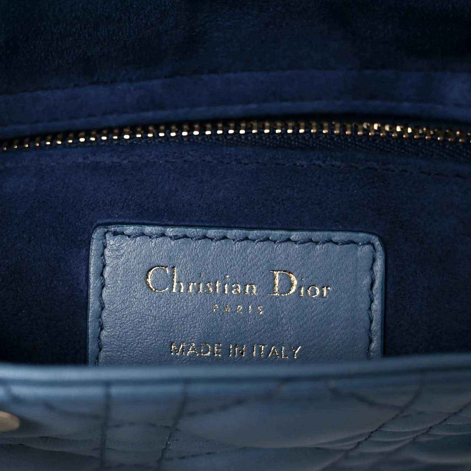 Indigo blue leather interior patch with Christian Dior and Made in Italy text