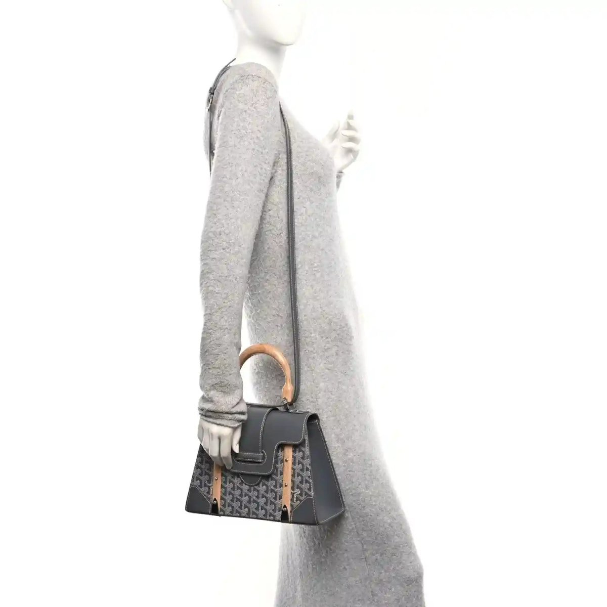 Grey canvas top-handle bag with black leather flap, wood handle, worn crossbody strap