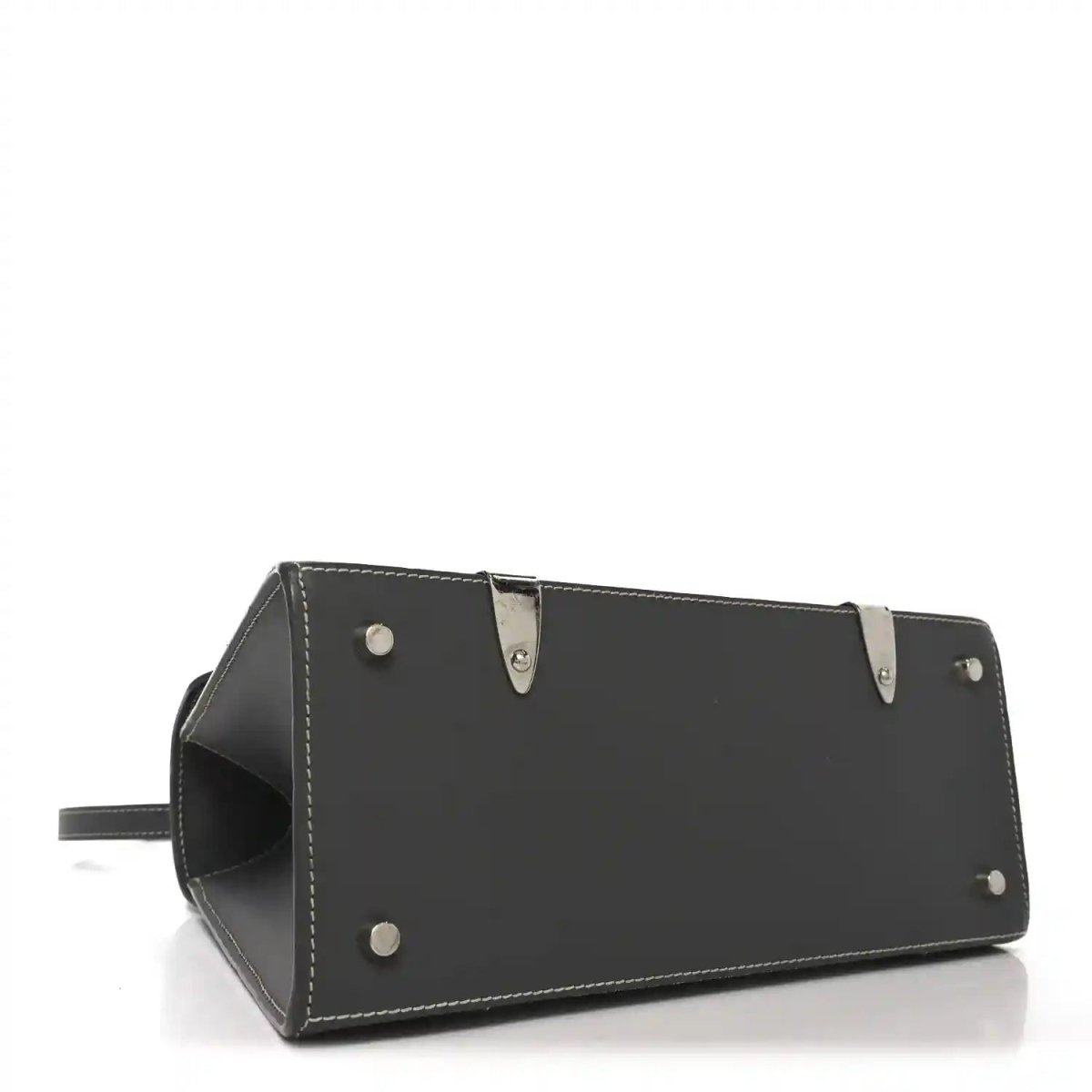 Black leather bottom panel of top-handle bag with metal studs and stitched edges