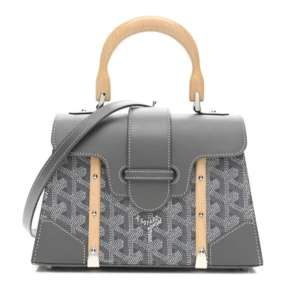 Grey mini Saigon bag with flap, patterned canvas sides, leather trim, wooden handles.