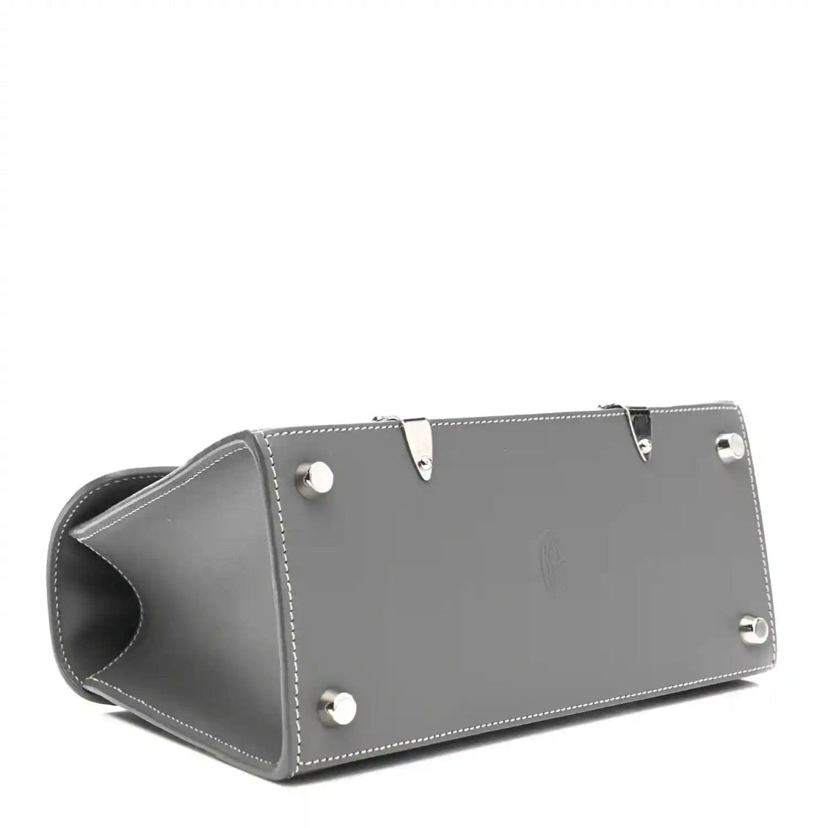 Grey leather mini Saigon bag bottom with metal studs and side seam stitching.