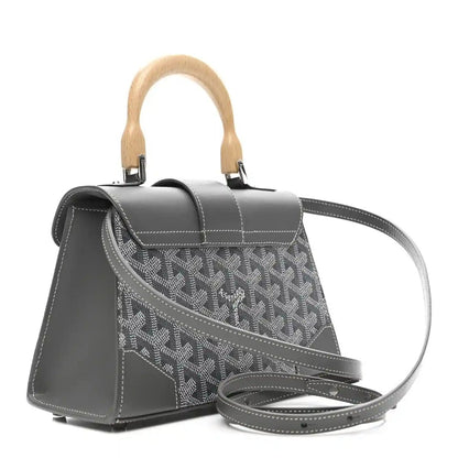 Grey mini Saigon bag with crossbody strap, patterned canvas front, leather top flap.