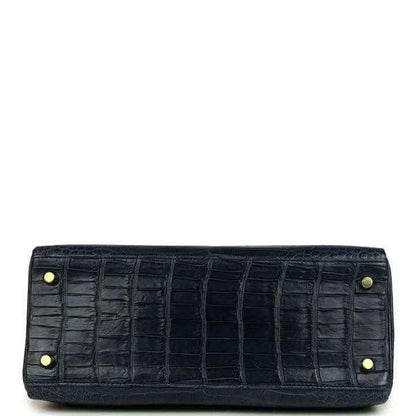 Hermès Kelly Retourne 28 bag close-up of front clasp and matte croc-embossed dark blue