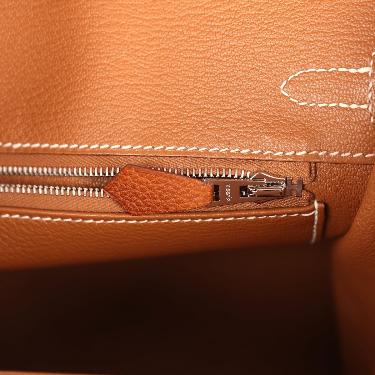 Hermes Birkin 25 handbag close-up of interior zipper track and metal zipper pull