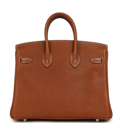 Hermes Birkin 25 leather handbag front view in tan with stitched straps and bottom feet