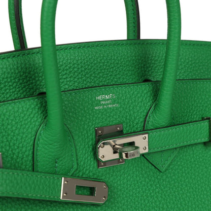Hermes Birkin 25 green leather handbag close-up of front clasp and logo stamp