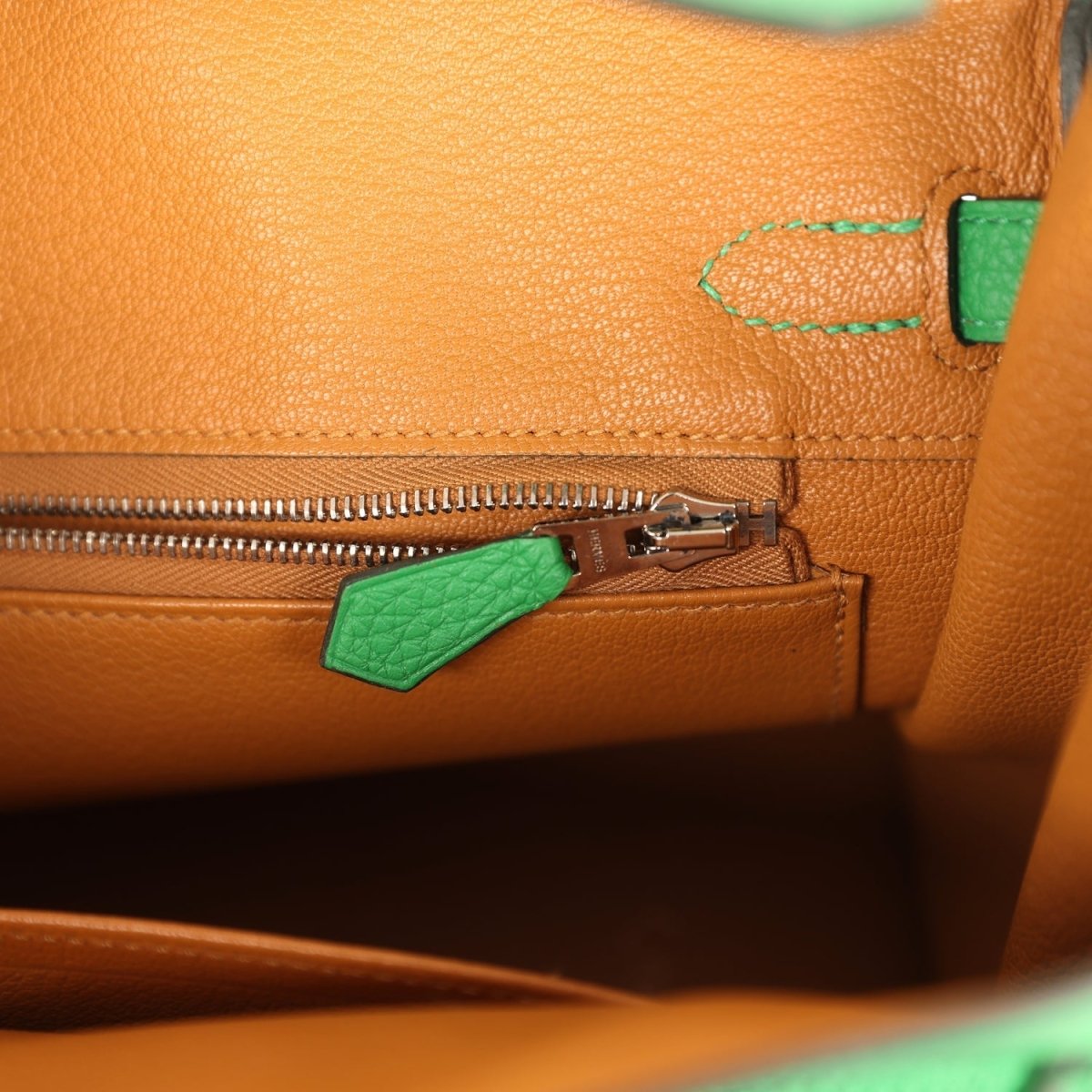 Hermes Birkin 25 tan leather interior with zipper pull and green leather tab