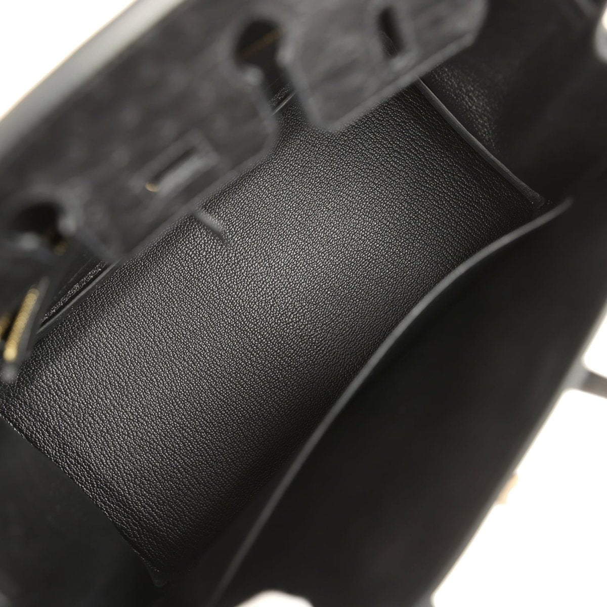 Black leather interior lining with stitched seam and pebbled texture