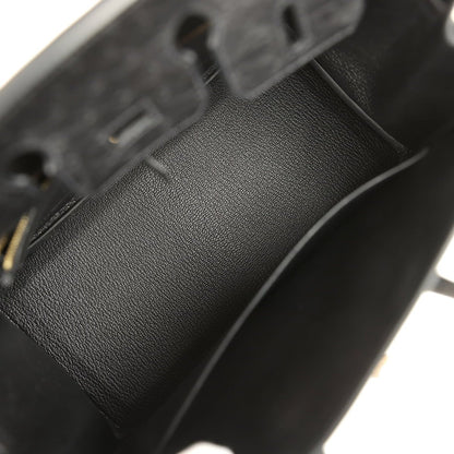 Black leather interior lining with stitched seam and pebbled texture