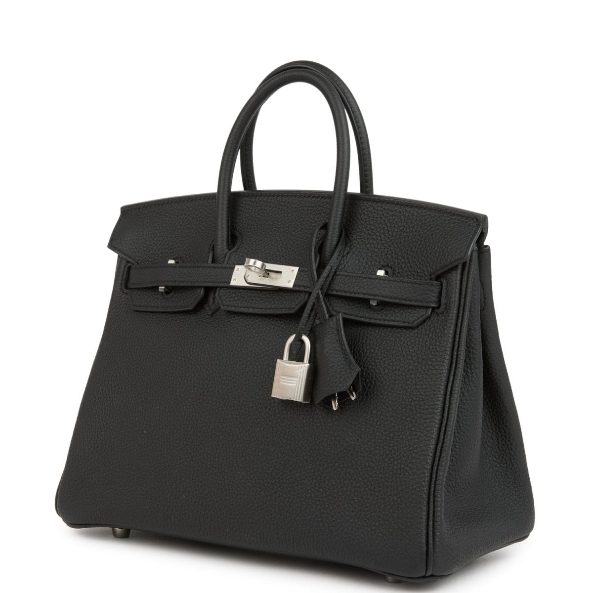 Black leather handbag with top handles, front flap closure, and hanging lock charm.