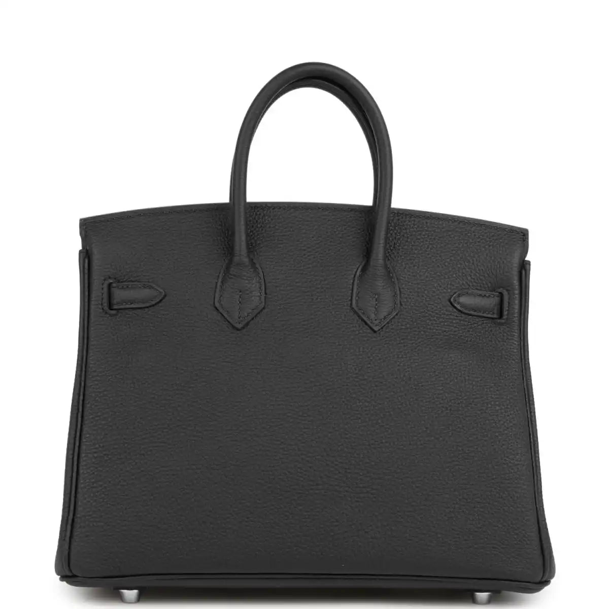 Black tote-style handbag with structured front, top handles, and embossed pocket details.