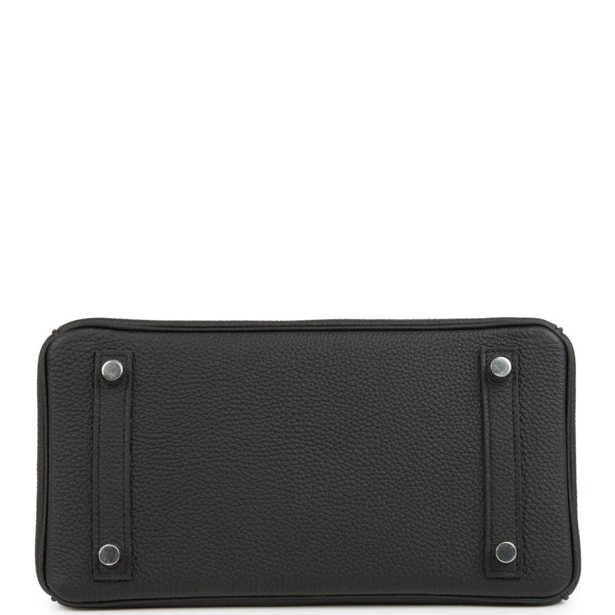 Black rectangular leather handbag front panel with snap posts and top stitching.
