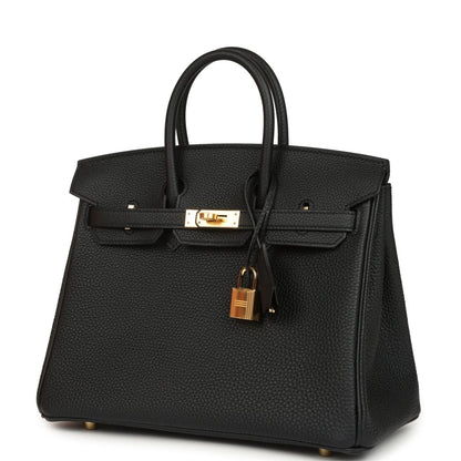 Black leather handbag with gold front clasp, padlock charm, and top handles