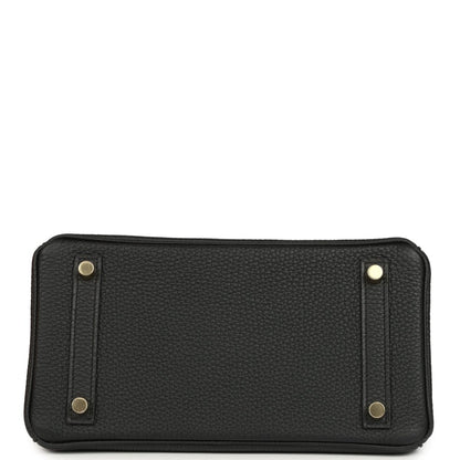 Black leather handbag base with four gold-toned studs and curved corners