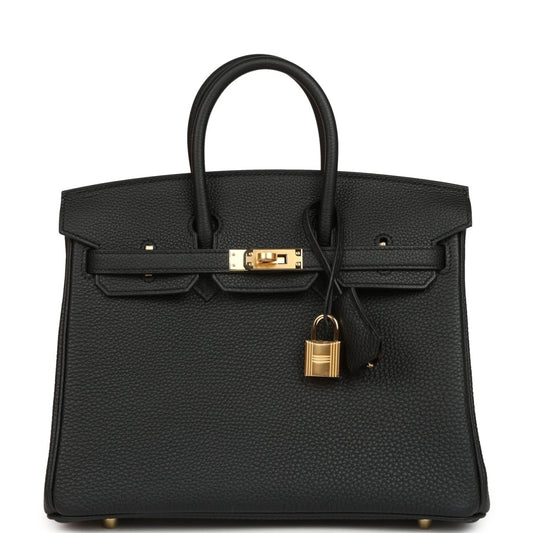 Black leather handbag with gold front clasp, padlock charm, and top handles