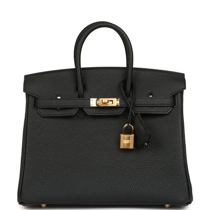 Black leather handbag with gold front clasp, padlock charm, and top handles